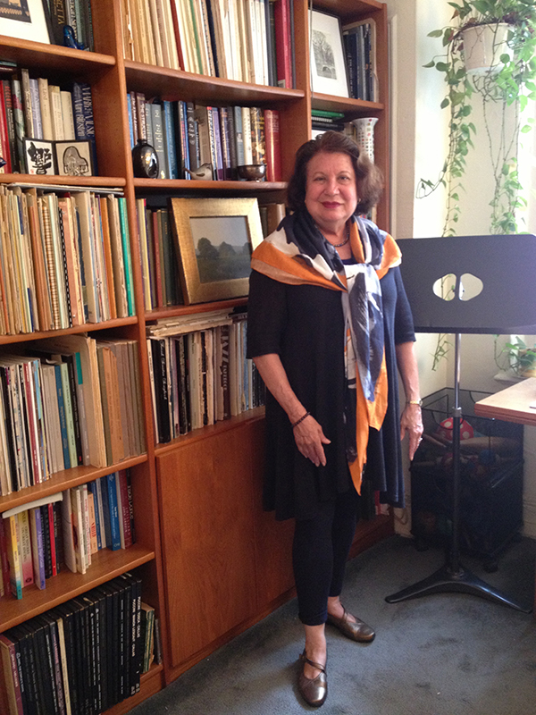 Susan Gregory in front of a bookshelf